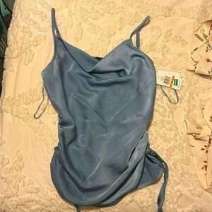 Brand New Tags On Blue Silky Top